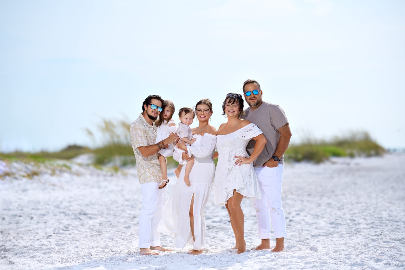 The Close family together on the beach, children and grandchildren
